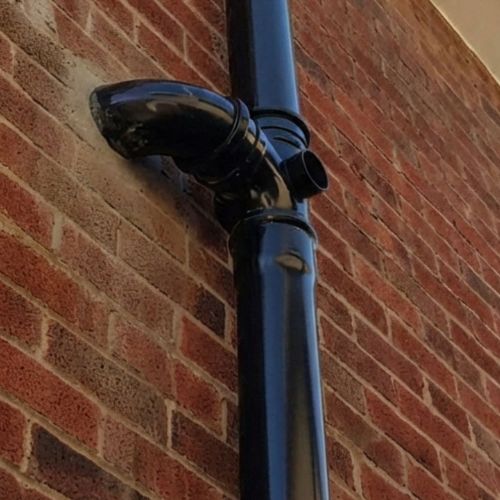 Aquaflow 110mm Plain Ended Pipe 3m fitted onto building - installed